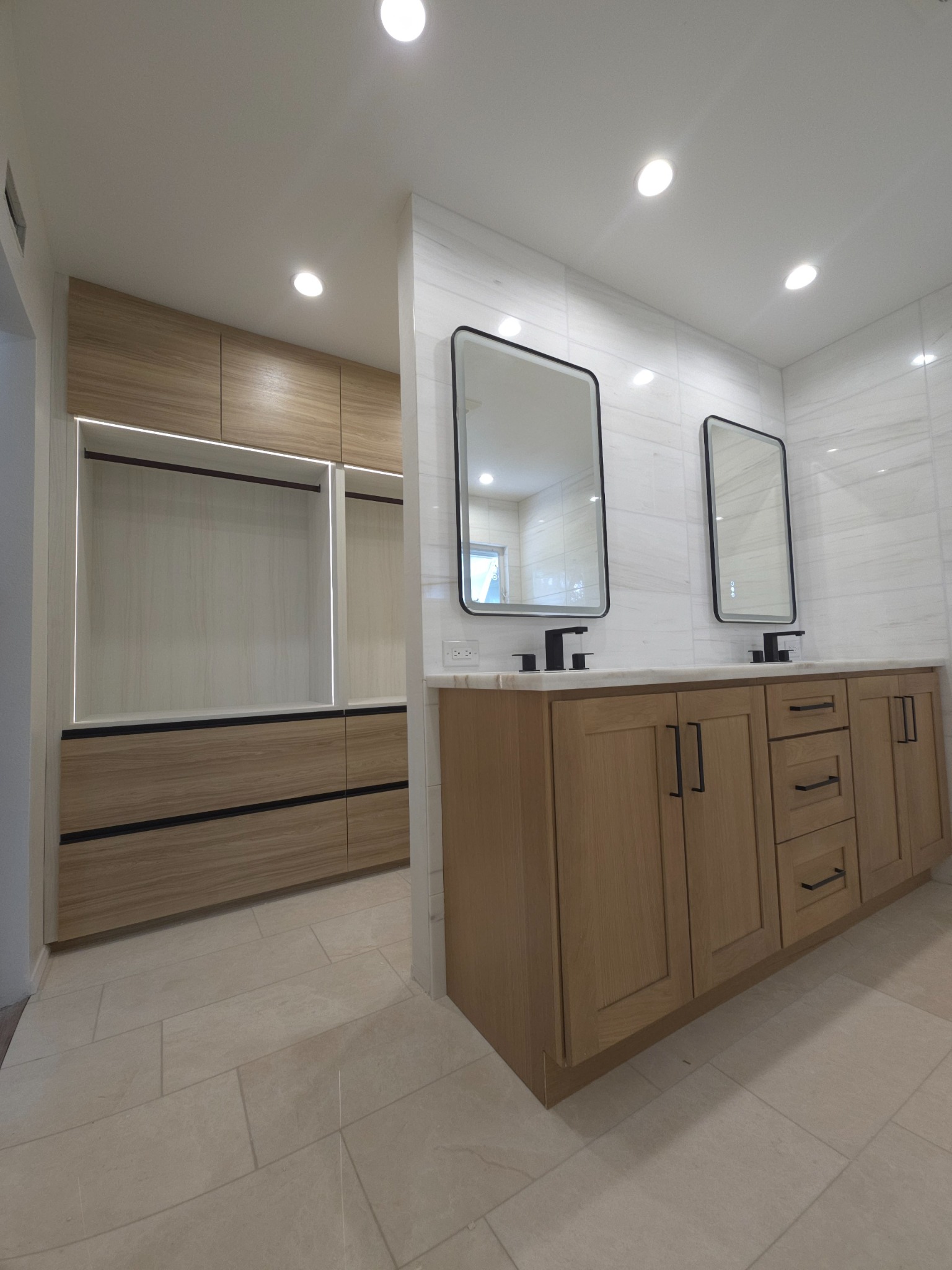Closet built-ins paired with matching vanity cabinetry.