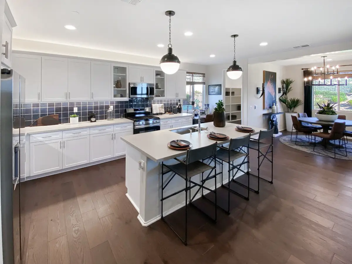 Kitchen with navy tile backsplash and dining area